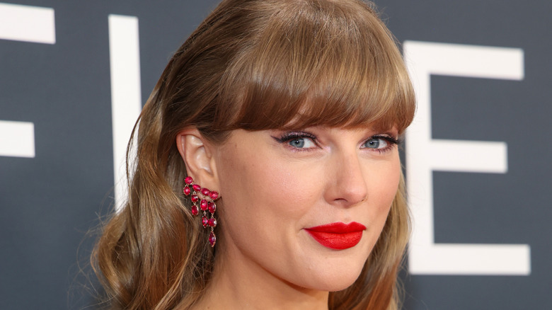 Taylor Swift smiling on red carpet