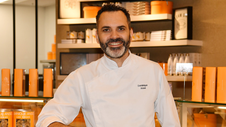 Pastry chef Dominique Ansel standing in his bakery
