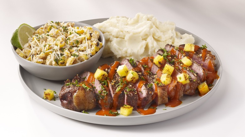 TGI Fridays plate of steak, corn, and mashed potatoes