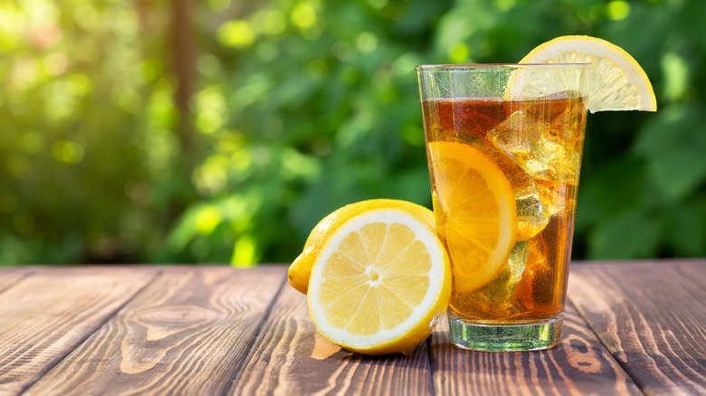 glass of iced sweet tea with lemon garnish