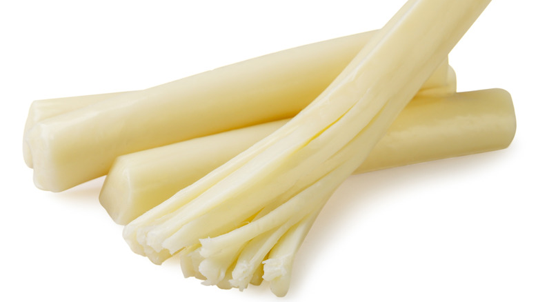 Close up of three string cheeses isolated on a white background