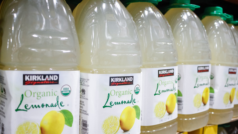 Five bottles of Kirkland Signature, Organic Lemonade on a shelf
