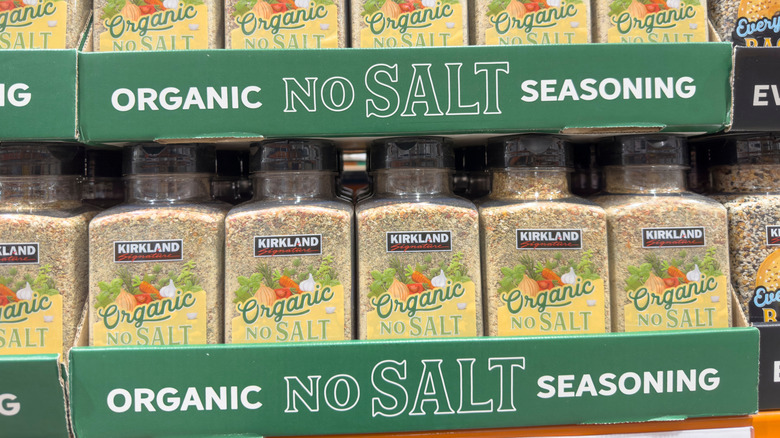 A case full of  Kirkland Signature Organic No-Salt Seasoning on a shelf at Costco