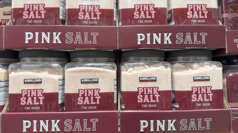 A shelf showing a selection of Kirkland Signature Pink Salt, Fine Grain.