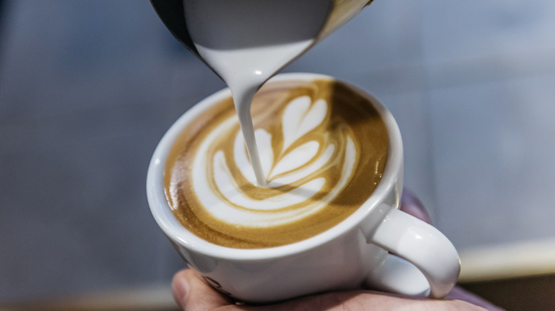 pouring milk for latte