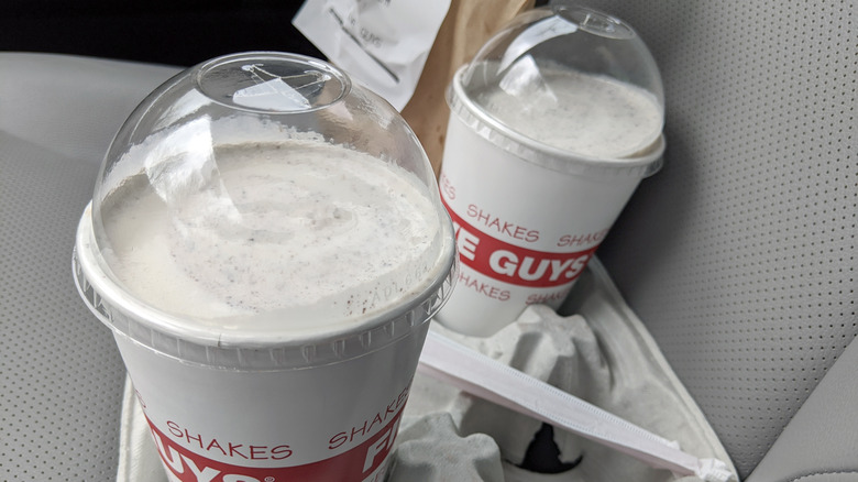 Five Guys milkshakes in a car