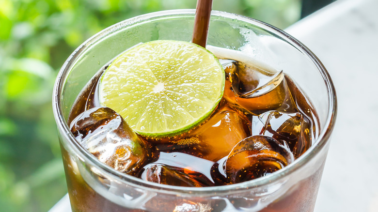glass of diet coke with lime slice