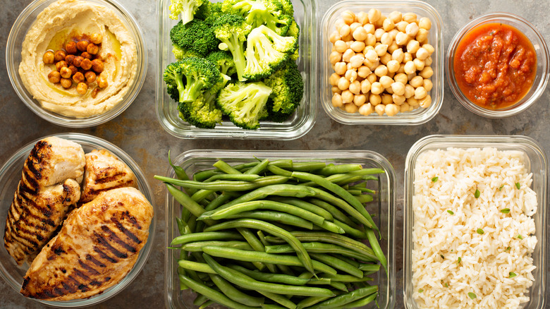 Containers with chicken, rice, and vegetables 