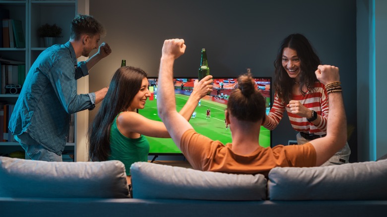 Friends watching football