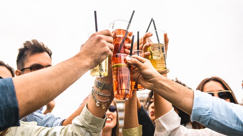 Friends toasting with drinks