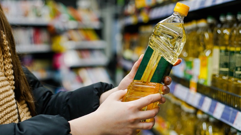 Woman holding cooking oil