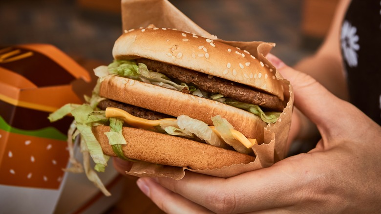 Woman holding Big Mac