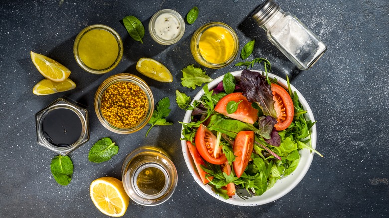 Assorted salad dressings and salad
