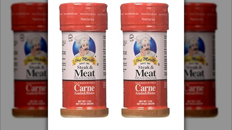 Isolated on a white background are two containers of Chef Merito Steak and Meat Seasoning