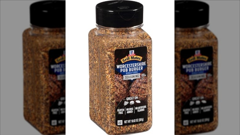 Isolated on a white background is a container of Grill Mates Worcestershire Pub Burger Seasoning