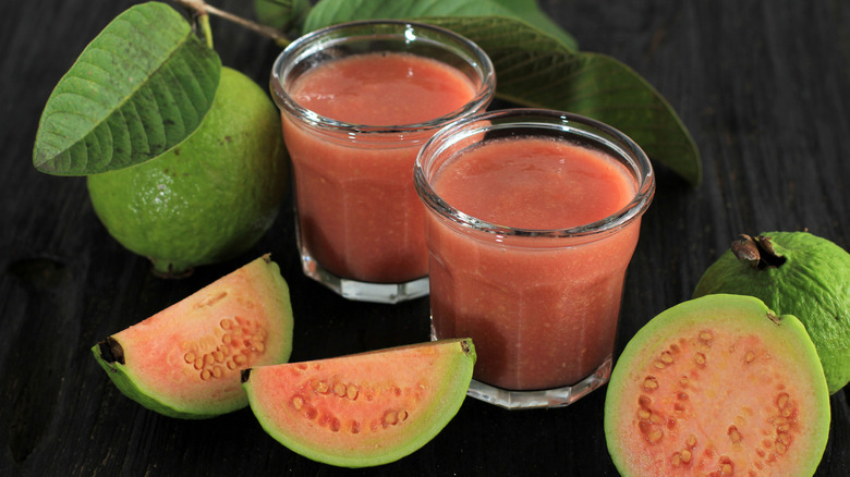 Two glasses of guava juice with fruits