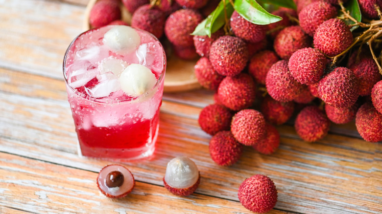 Lychee drink on table with whole lychees