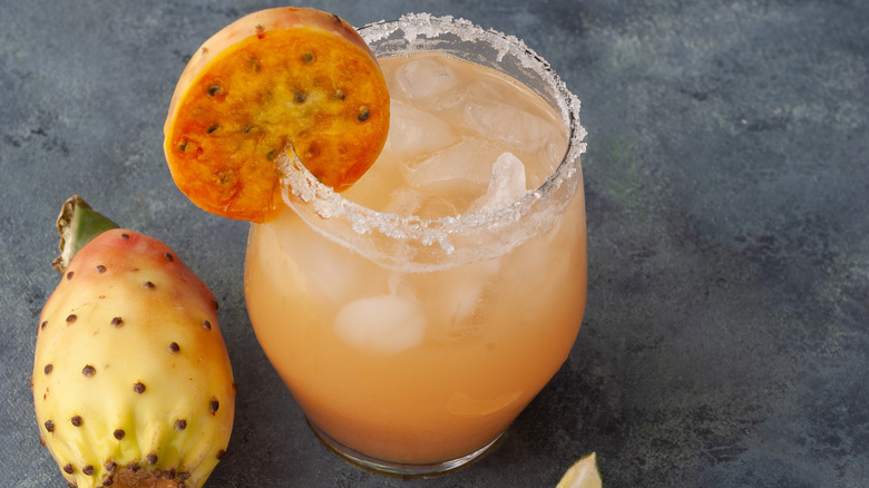 Cocktail with a sugar rim, garnished by a prickly pear slice