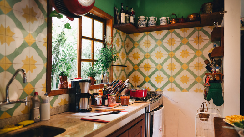 Kitchen with yellow and green wallpaper