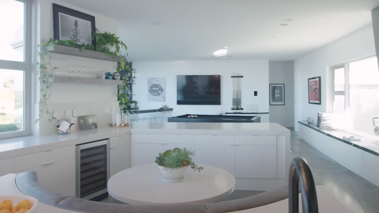Nyjah Huston's kitchen with white fittings and a round table