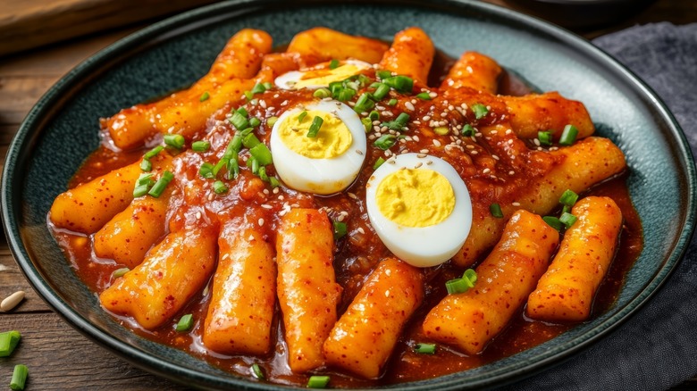Plate of tteokbokki in gochujang sauce with boiled eggs