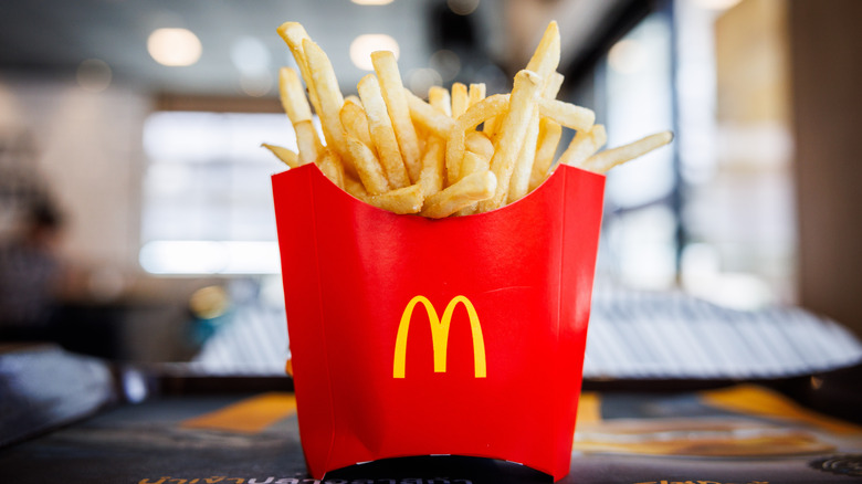 A box of McDonald's fries on a restaurant table