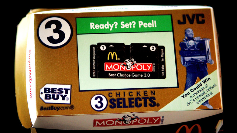 A McDonald's box of Chicken Selects with a Monopoly token on top