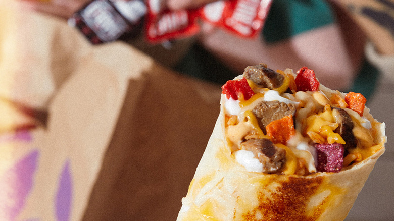 Burrito with hot sauce packages