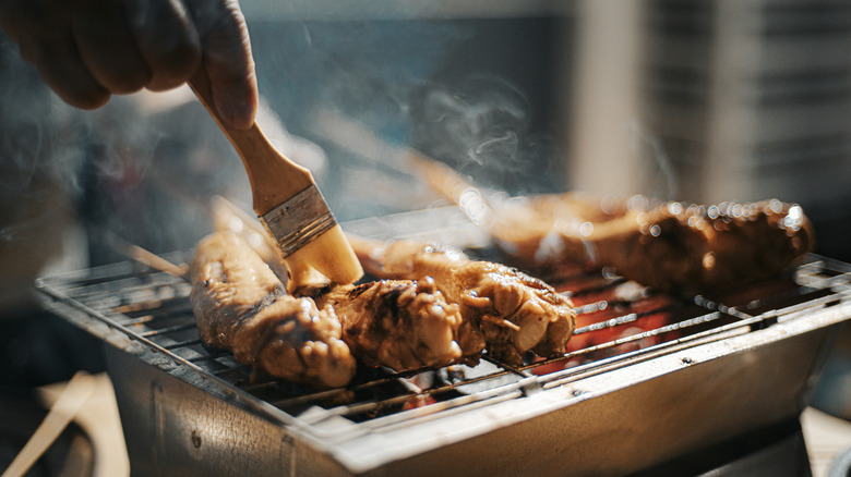 Brushing marinade over a kebob