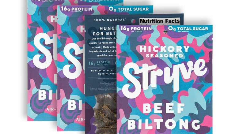 Four bags of Stryve beef jerky against a white background