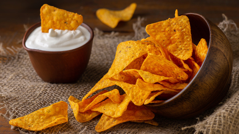 tortilla chips spilling from bowl