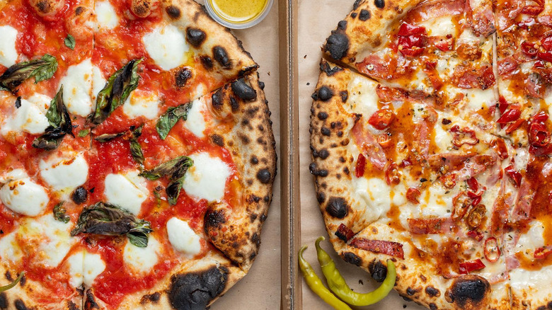 two pizzas in boxes