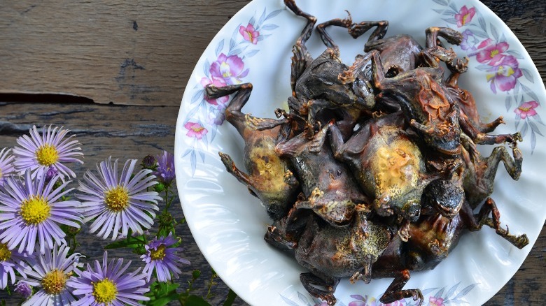 cooked bullfrogs on white plate