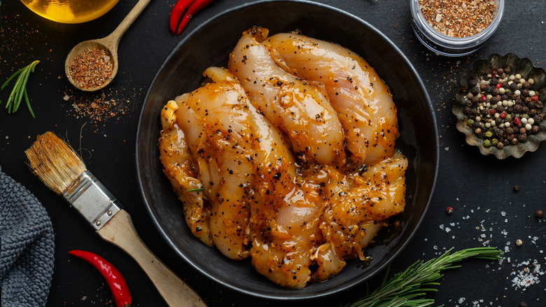 Raw chicken sitting in marinade
