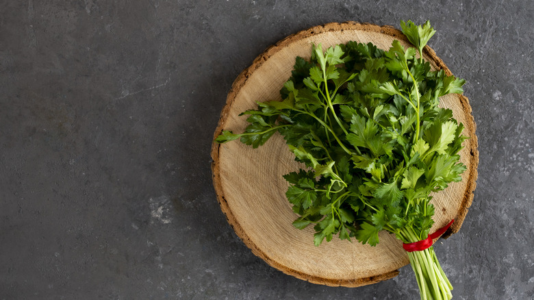 Bunch of parsley on a block of wood