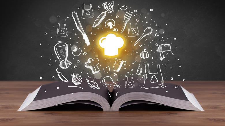 open book with culinary imagery hovering above