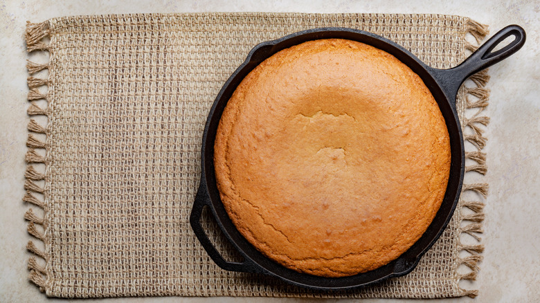A cast iron skillet with baked cornbread.
