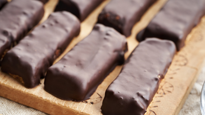 Homemade chocolate bars on wooden board