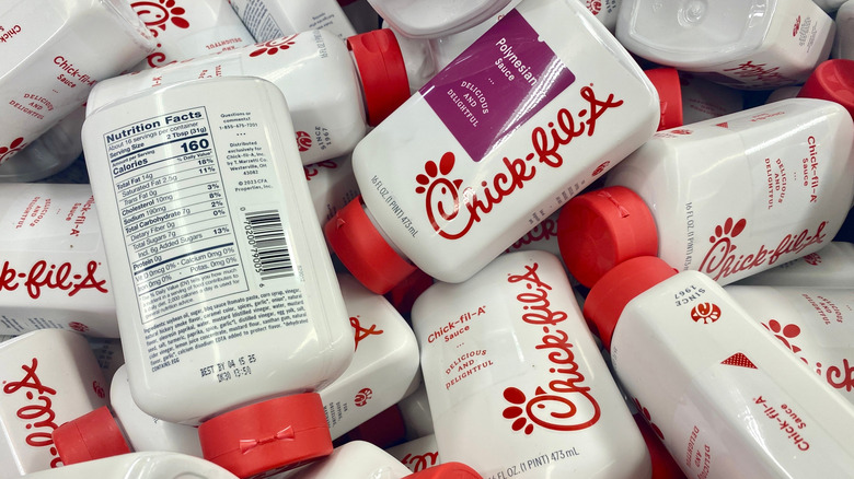 Pile of Chick-fil-A sauce bottles