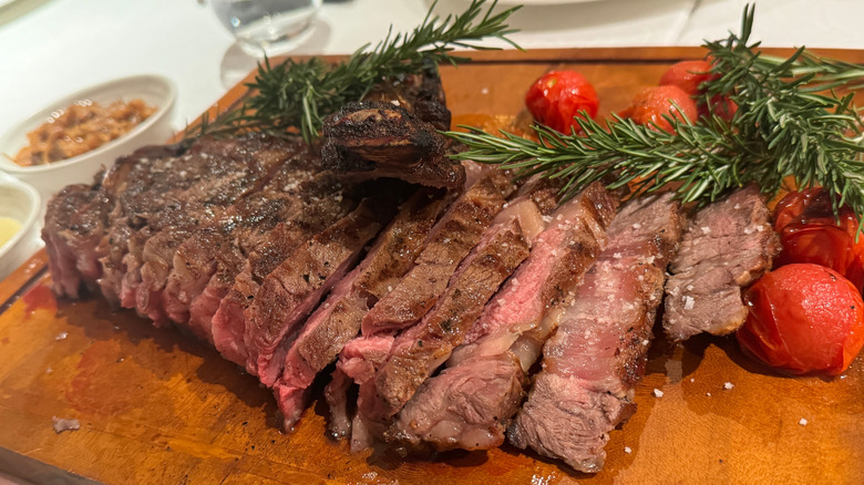 Medium-well steak with rosemary and cherry tomatoes