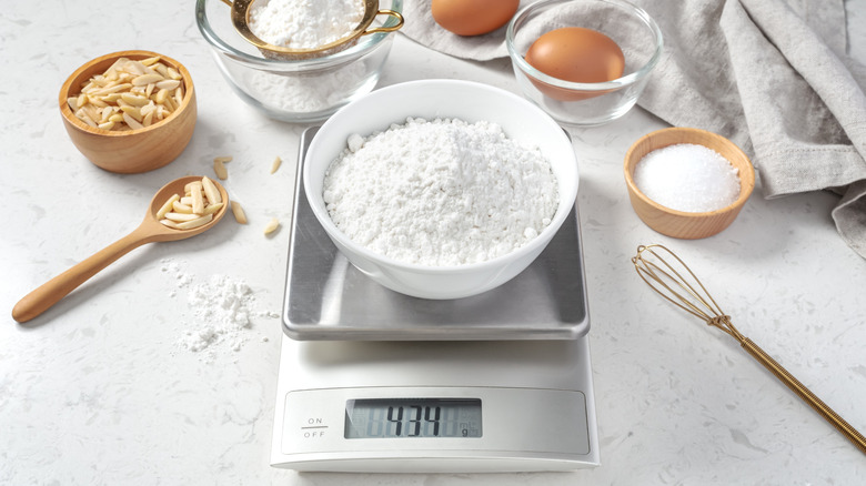 Digital food scale with bowl of flour