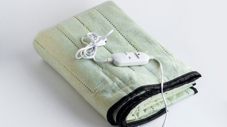 Folded green electric heating pad