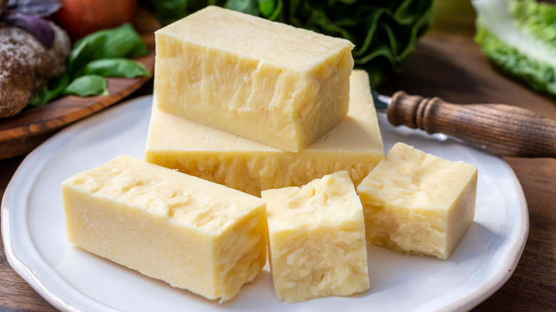 Plated blocks of white cheddar 