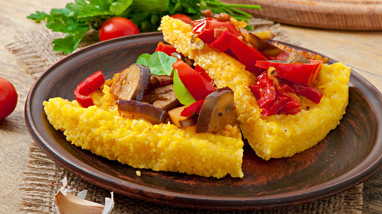 Polenta crust pizza with tomatoes, eggplant, and basil