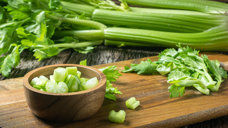 Sliced celery on cutting board