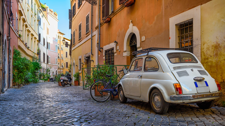 Car parked on cobble road