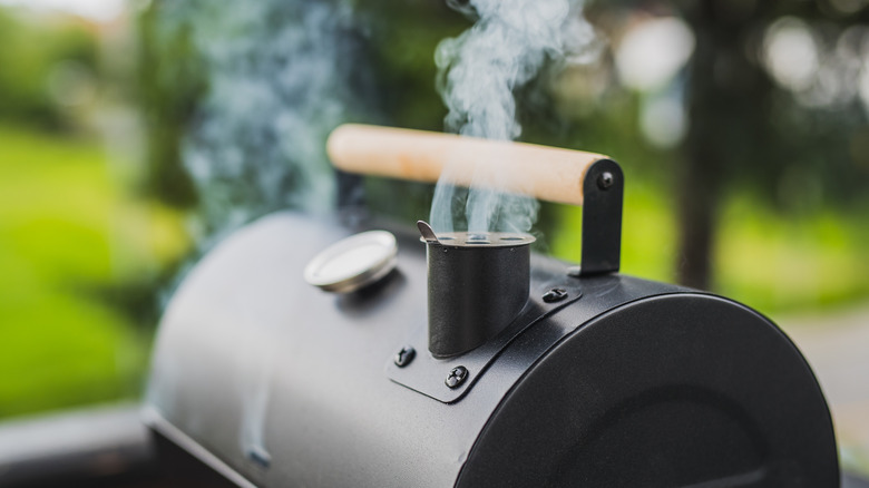 A smoker with smoke billowing