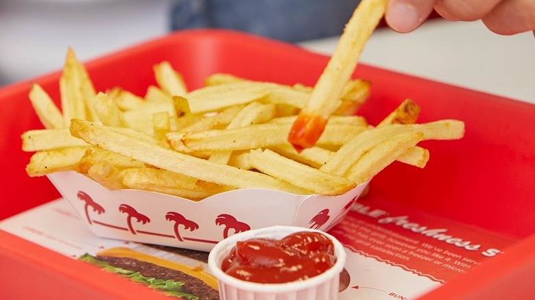 In-N-Out fry dipped into ketchup