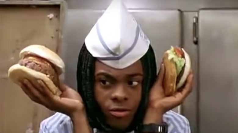 Man holding two burgers