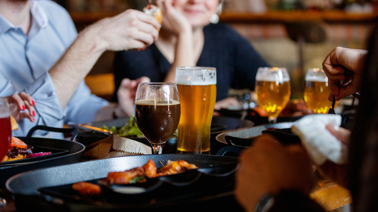Customers enjoying drinks in gastropub